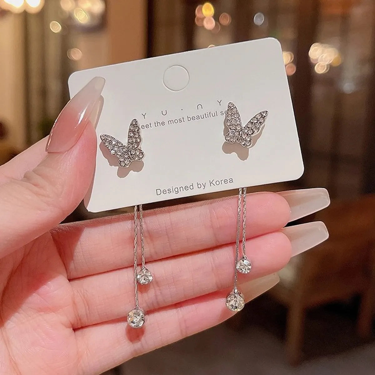 Ladies charmed butterfly dangling diamond earrings