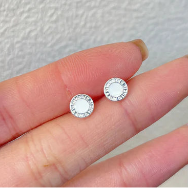 Ladies silver and white ear rings alloy.