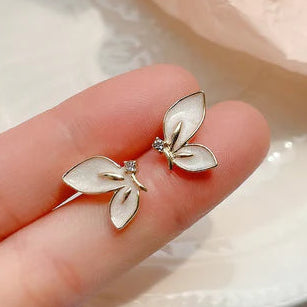 Ladies cute alloy white an golden half butterfly ear rings.
