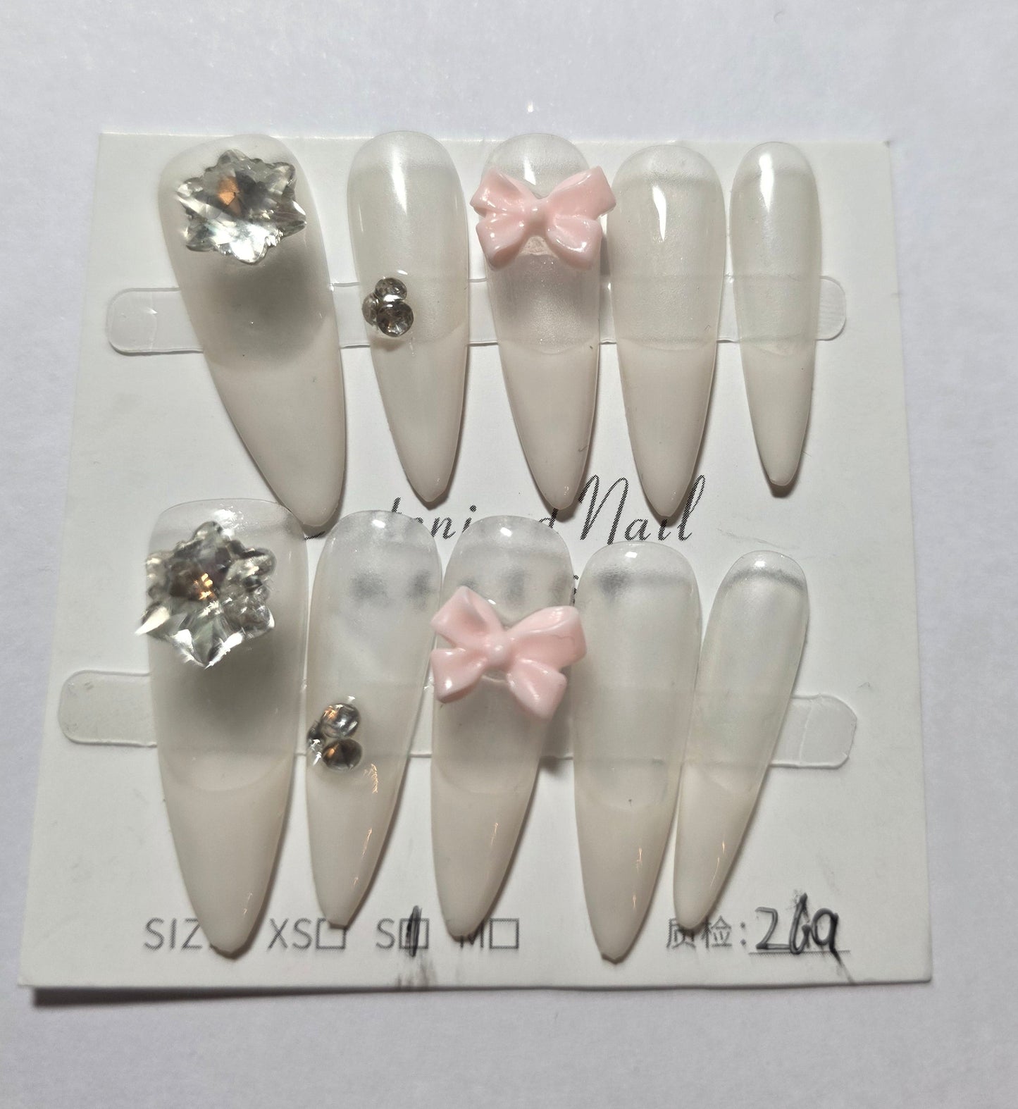 Ladies irrdescent nails with white french tip with small pink bow and gems press on nails small