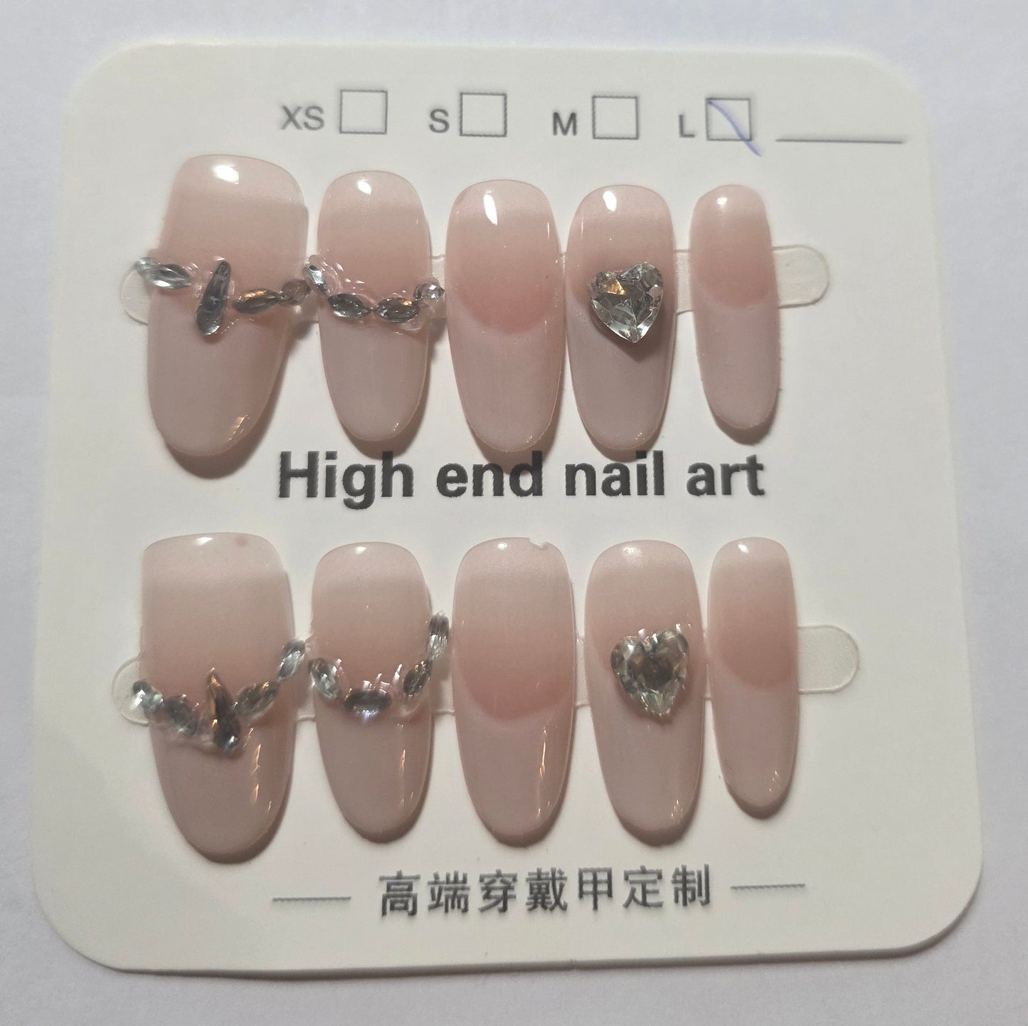 Ladies handmade, reusable, rounded cute creamy pink coloured nails with cute little diamonds large