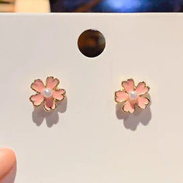 Ladies pink alloy golden flowers with pearls in the middle ear rings.