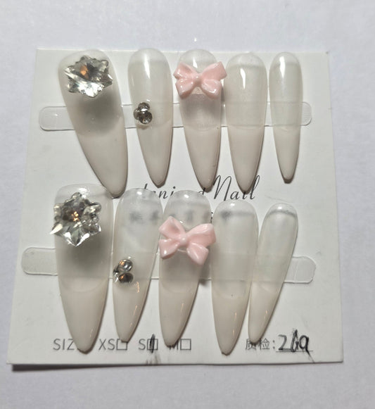 Ladies irrdescent nails with white french tip with small pink bow and gems press on nails small