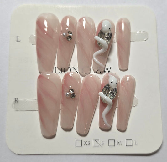 Elegant pink and white with white snake holding a diamonte press on nails small